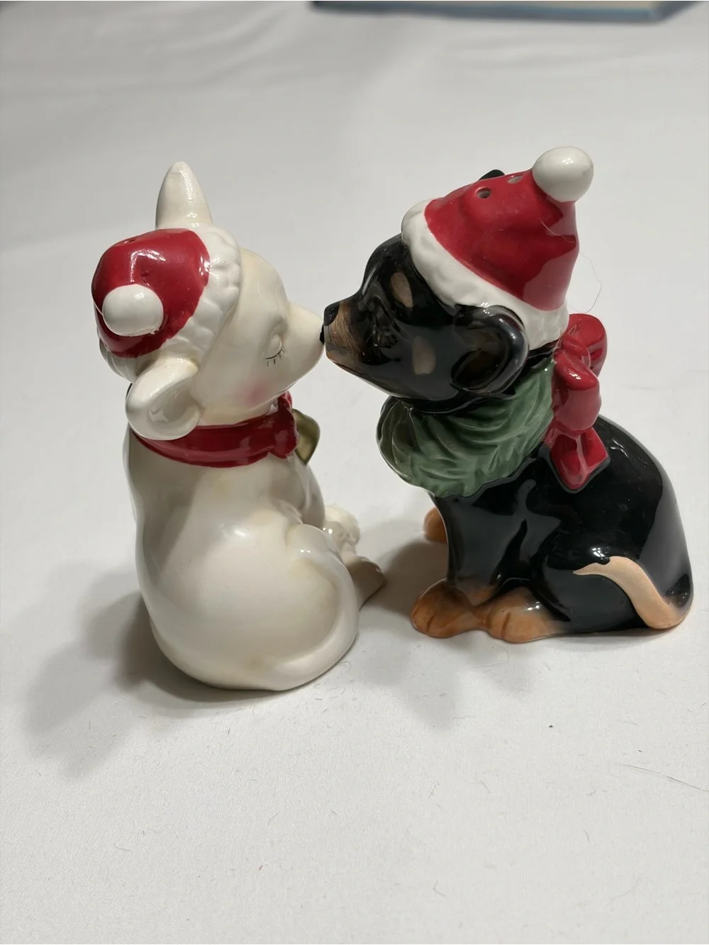 Chi Chi  Ceramic Salt and Pepper Shakers. Magnetic kissing.
